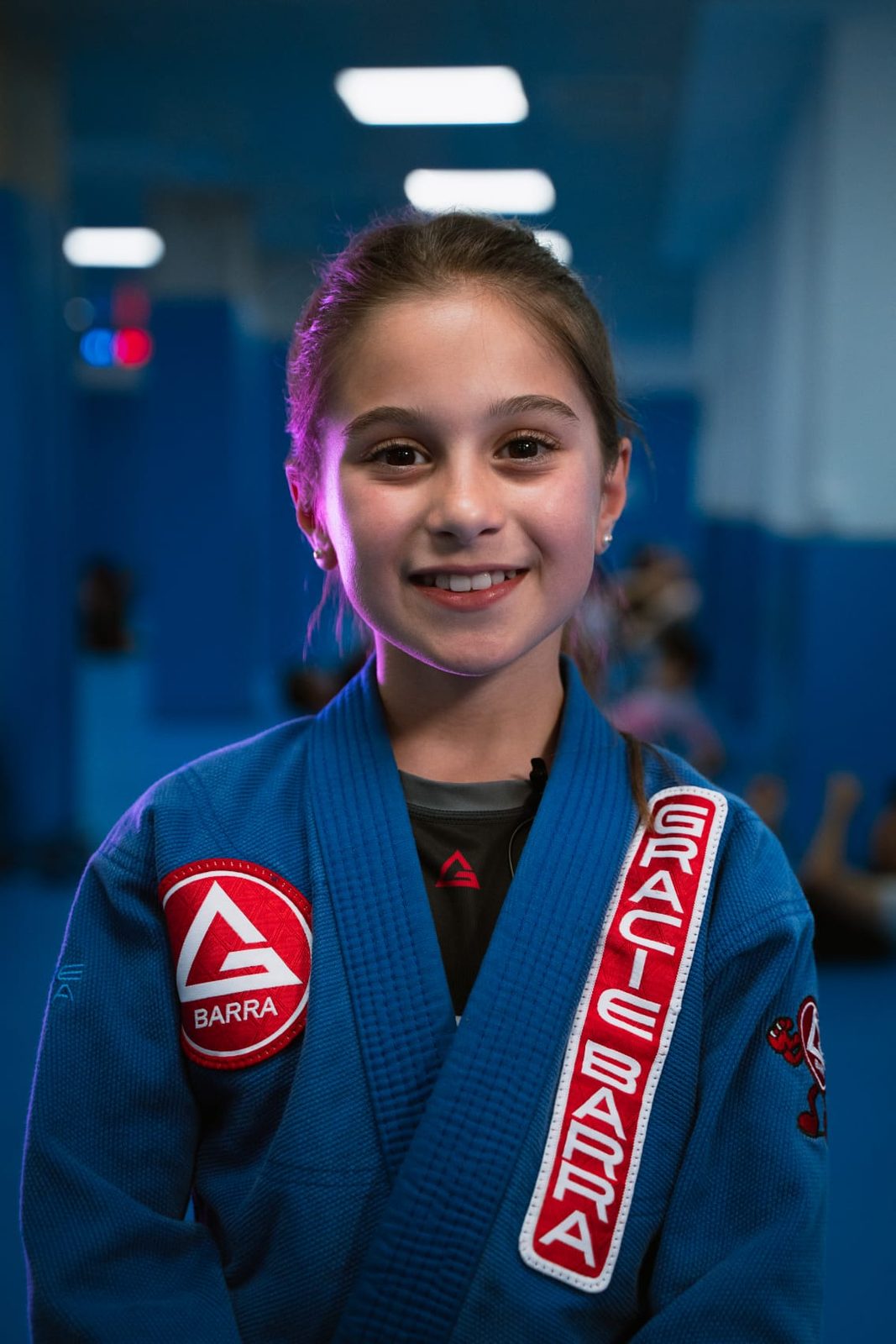 A young Gracie Barra student in a blue gi