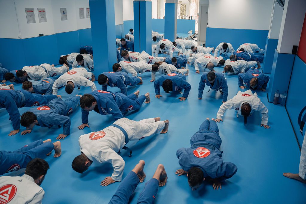 A Gracie Barra class doing push-ups together